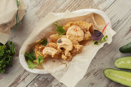 Georgian dish on the table photo for the menu of Eastern Caucasian cuisine. Fried squid.の写真素材