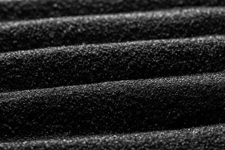 Black sand dunes background. Bump trace. Creative sand relief.の写真素材