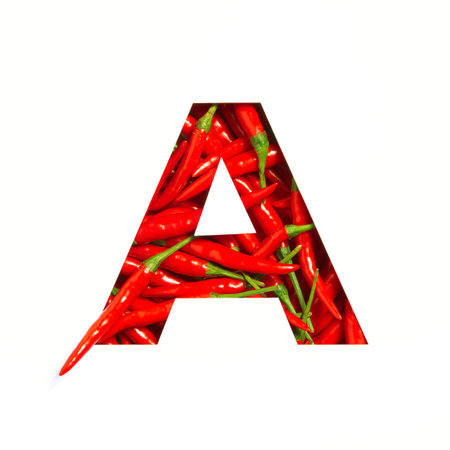 Letter A of English alphabet of hot red chili pepper and cut paper isolated on white. Font of spicy vegetablesの写真素材