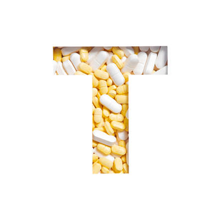 Pills of medicines, vitamins and nutritional supplements. Letter T of alphabet isolated on white. Drugstore typefaceの写真素材