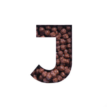 Letter J of English alphabet of nutritional chocolate cereal balls, white cut paper. Typeface for organic products storeの写真素材