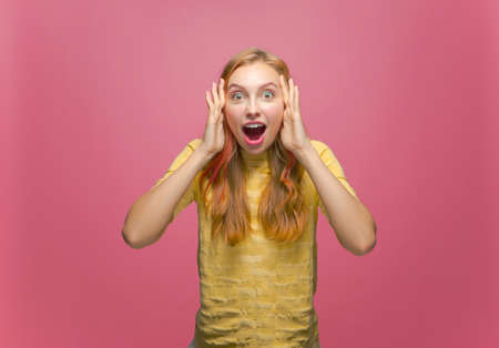 Wow emotion. Excited amazed young girl open mouth in astonishment overjoyed. Amazing profitable online store offerの写真素材