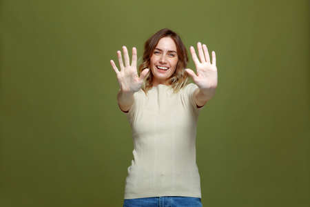 Happy friendly sincere young girl showing open clear palms, smiling. Body language. Trust, good...