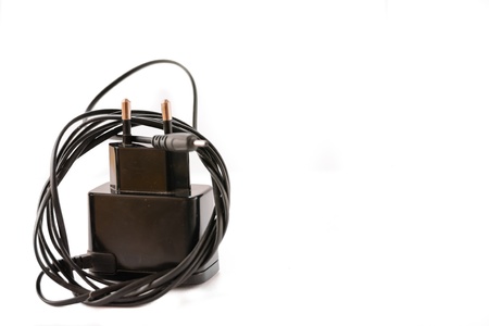 European mobile phone battery charger and adapter on white background 