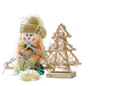 Figure of snow man with strawy tree on white background の写真素材