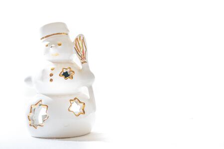 Beautiful ceramics snowman on white background の写真素材