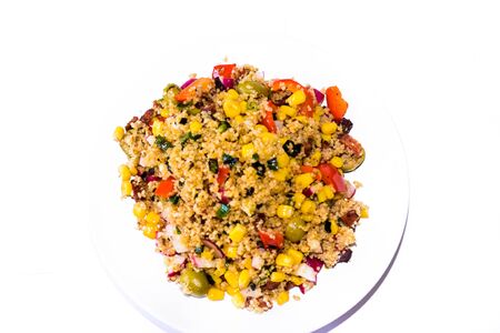 Detail of home made Vegetable cous-cous meal in a white bowl on a white background の写真素材