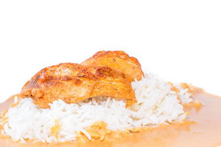 Detail of home made Chicken with pepper sauce and basmati rice isolated on white backgroud の写真素材