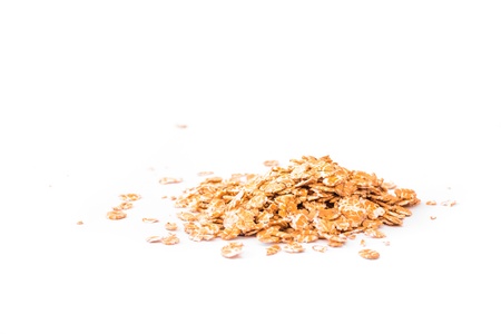 Detail of Wheat flakes on white background の写真素材