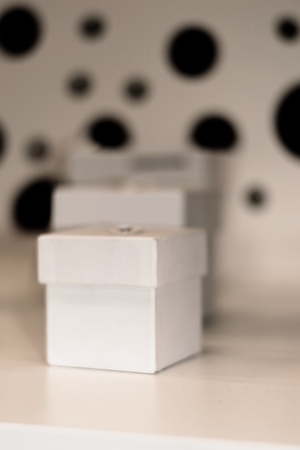 Three white gift boxes with small ribbon Blue gift box for wedding christmas and valentine celebration.の写真素材