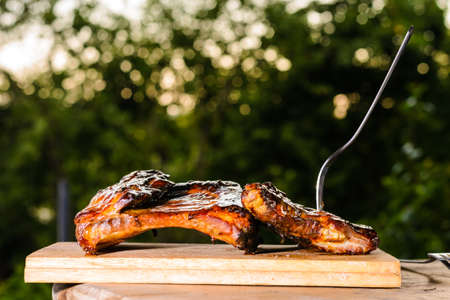 Grill rib on table with work. Home made. In the country.の写真素材