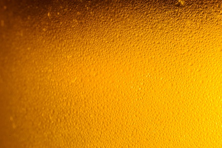 Colorful abstract bacground orange. Close up of beer glass.の写真素材
