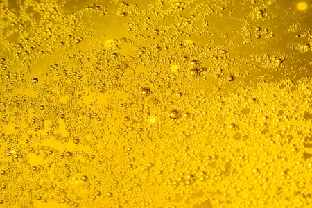 Colorful abstract bacground orange. Close up of beer glass.の写真素材