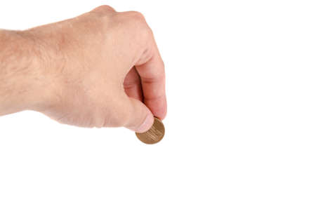 A hand holding a coin on white background