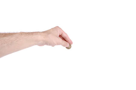 A hand holding a coin on white background