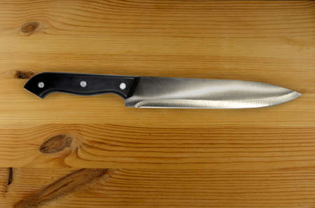 Knife on rustic kitchen table with copy spaceの写真素材
