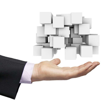 abstract cubes for conceptual use over a businessman hand isolated on white backgroundの写真素材