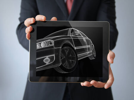engineering car concept: lines car render on a businessman tabletの写真素材