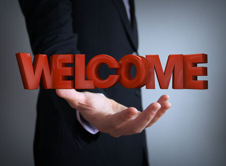 welcome text over businessman handの写真素材