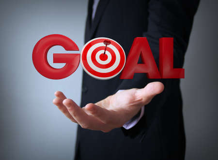 goal text over businessman handの写真素材