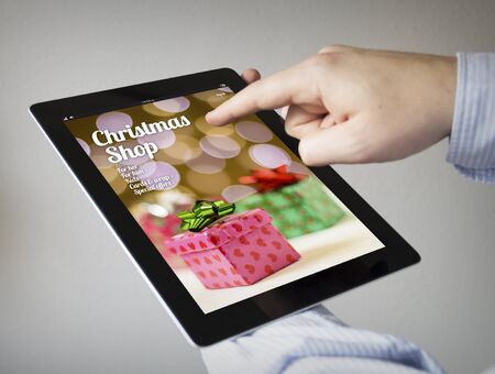 new technologies concept: hands with touchscreen tablet with online shopon the screen. Screen...