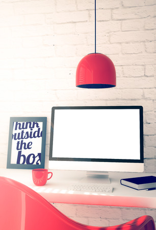 red workspace with blank screen computer. 3d illustration.の写真素材