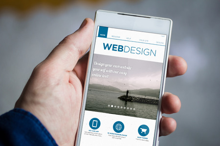 man hand holding web design smartphone.の写真素材