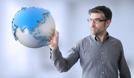 businessman touching earth globeの写真素材