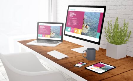 responsive design concept: view of tablet, computer, laptop and touchscreen smartphone on a desktop....