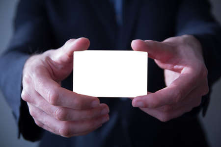 businessman holding blank business cardの写真素材