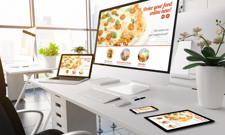 3d rendering devices on modern office. order food online website on screen.の写真素材