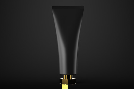 Cosmetic tube mockup 3d rendering on black and goldの写真素材
