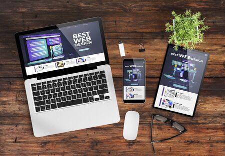 responsive design  website on devices top view wooden desktop 3d renderingの写真素材