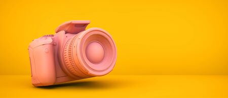 pink camera on yellow background 3d renderingの写真素材