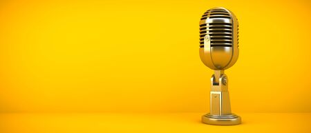Gold microphone on yellowの写真素材