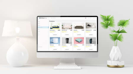Online shop website on computer at minimal desktop with lamp and plant 3d renderingの写真素材