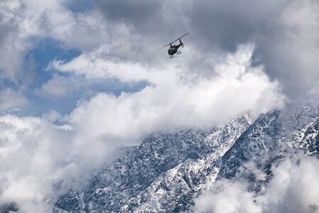Misty Moutain and helicopterの写真素材