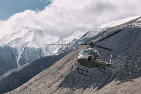 Misty Moutain and helicopterの写真素材