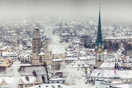 Winter landscape of Zurich with churches and lake. Grossmunster, Fraumunster and Enge.の写真素材