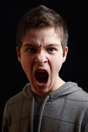 Young man shouting out his boldness and decision