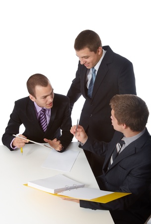 Three young business people debating a project, isolated on whiteの写真素材