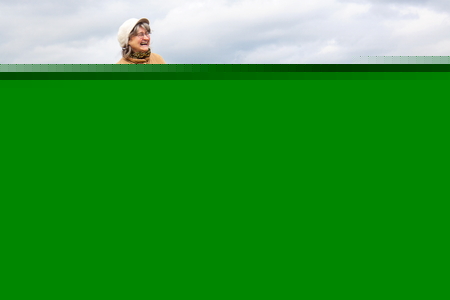 Elderly couple having fun and playing the wheelbarrow in nature.  "Woman carried his husband until old age."の写真素材