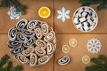 Decorative arrangement with croissants and slices of cake on cake shortcrust for the winter holidaysの写真素材