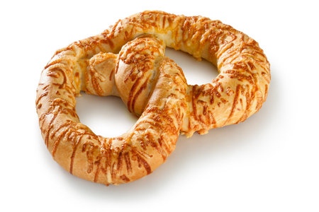 Mouthwatering image featuring a fresh and delicious bagel topped with savory cheese, presented on a clean, white background. this appetizing composition captures the essence of breakfast and culinary delight. the closeup view showcases the crispy texture of the bagel, making it a perfect choice for various culinaryの写真素材