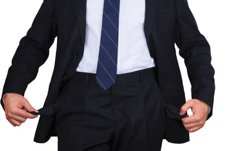 businessman standing isolated on the white background and showing his empty pocket, turning his pocket inside out, no moneyの写真素材