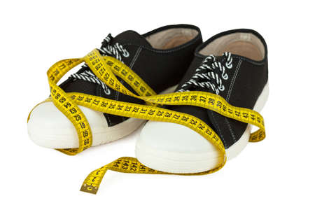 Gumshoes and centimeter isolated on white backgroundの写真素材