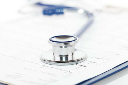 Blue stethoscope on blue clipboard with ecgの写真素材