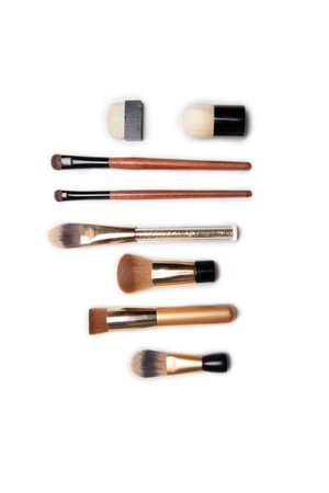 Different makeup brushes isolated on white background