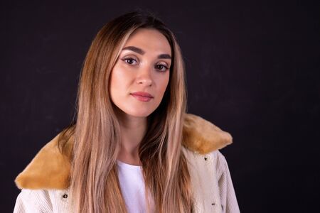 A young girl in a jacket with a collar.の写真素材