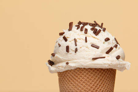Ice cream with chocalate topics on solid background.の写真素材